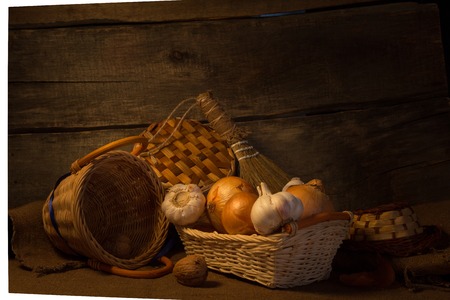 Vintage still life with onion and basketの写真素材