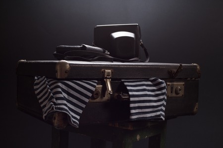 Vintage still life with a suitcase and a frockの写真素材