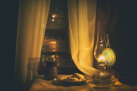 Still life with kerosene lamp near the window. Processing - a soft, diffused lightの写真素材