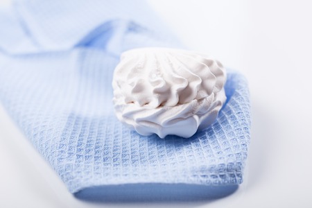 Fresh delicious marshmallow on a blue napkin close upの写真素材