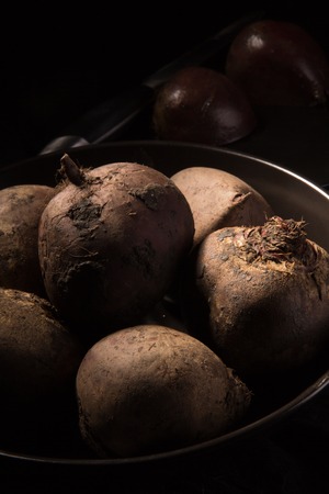 Red juicy beetroot on a dark background