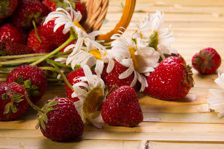 Fresh ripe juicy strawberries on a silver saucerの写真素材