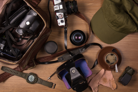 Flat lay photography with an old film cameras and a cup of coffeeの写真素材