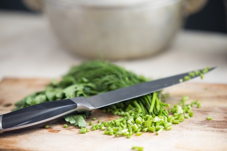 Dill and parsley on the kitchen tableの写真素材