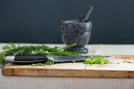 Dill and parsley on the kitchen tableの写真素材