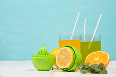 Refreshing drinks from fresh fruit on a turquoise background