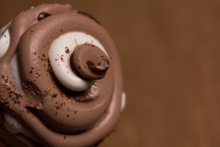 Creamy chocolate ice cream closeup on a brown backgroundの写真素材