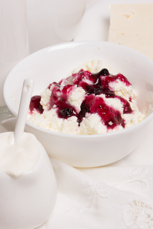 fresh sour cream and quark on a white tableの写真素材