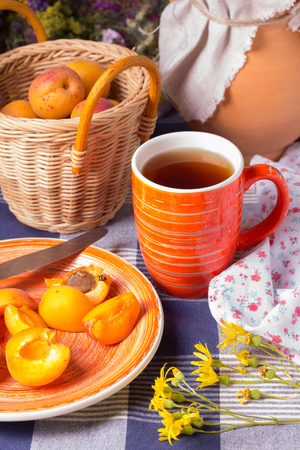Fresh ripe juicy apricots on the kitchen tableの写真素材