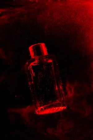 Perfume bottle on a dark abstract backgroundの写真素材
