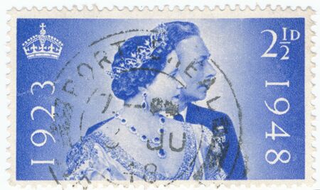 POLTAVA, UKRAINE - APRIL 27, 2019. Vintage stamp printed in Great Britain 1948 shows the 25th Anniversary of the Wedding of King George and Queen Elizabethのeditorial素材