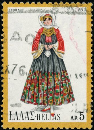 POLTAVA, UKRAINE - October 20, 2019. Vintage stamp printed in Greece circa 1974 show woman in folk costumeのeditorial素材