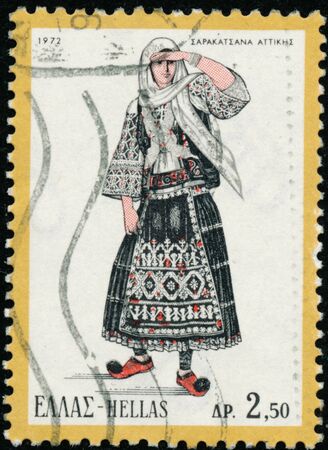 POLTAVA, UKRAINE - October 20, 2019. Vintage stamp printed in Greece circa 1972 show woman in folk costumeのeditorial素材