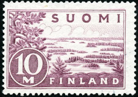 POLTAVA, UKRAINE - January 9, 2020. Vintage stamp printed in Finland circa 1930 show landscapeのeditorial素材