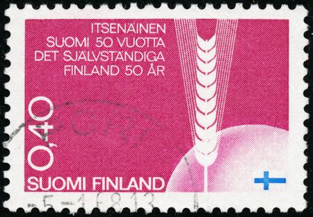 POLTAVA, UKRAINE - January 16, 2020. Vintage stamp printed in Finland circa 1967 show 50th anniversary of the Republicのeditorial素材