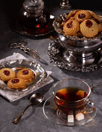Tea and cookies in vintage utensilsの写真素材