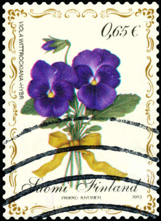 POLTAVA, UKRAINE - April 24, 2020. Vintage stamp printed in Finland circa 2003 show flowerのeditorial素材