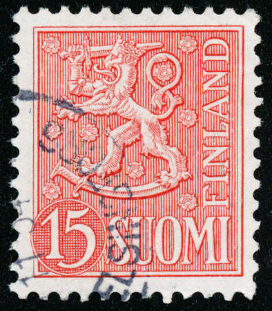 POLTAVA, UKRAINE - May 15, 2020. Vintage stamp printed in Finland circa 1954 show coat of arms with a lionのeditorial素材