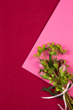 Creative background with a bouquet of fresh flowers and place for text.の写真素材