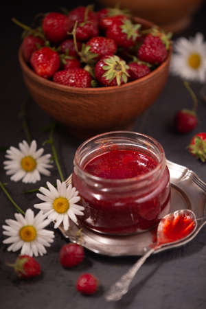 Delicious strawberry jam and fresh ripe berriesの写真素材