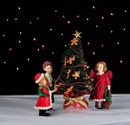 children decorating ginger bread tree.の写真素材