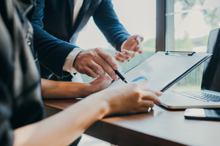 Business people meeting hand pointing at business documents and ideasの写真素材