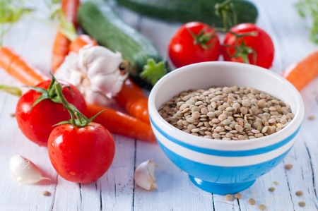 raw lentil and vegetables for cooking, selective focusの写真素材