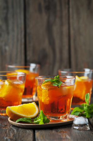 Glass of aperol with ice, orange and mint, selective focusの写真素材