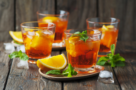 Glass of aperol with ice, orange and mint, selective focusの写真素材