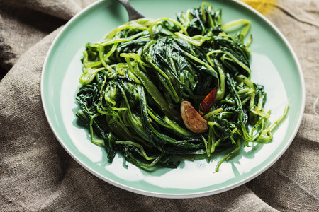 Typical italian vegan dish boiled chicory, selective focusの写真素材