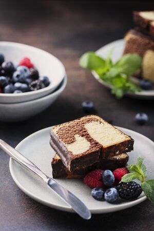 Sweet marble plumcake with chocolate and berry, selective focus imageの写真素材