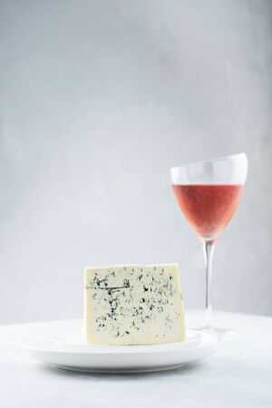 Italian cheese gorgonzola with rose wine, selective focus imageの写真素材
