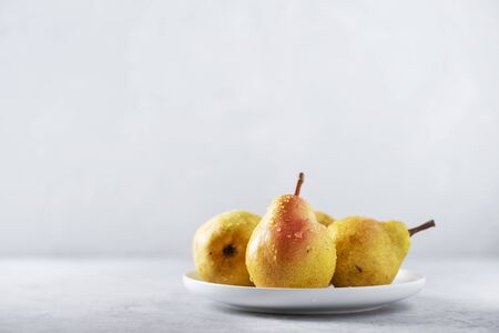 Sweet yellow pears on the table, concept of healthy food, selective focus imageの写真素材