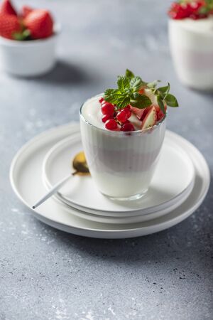 Homemade yogurt with strawberry, currant and mint, selective focus imageの写真素材