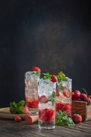 Mojito cocktail with strawberry, ice and mint, selective focus imageの写真素材