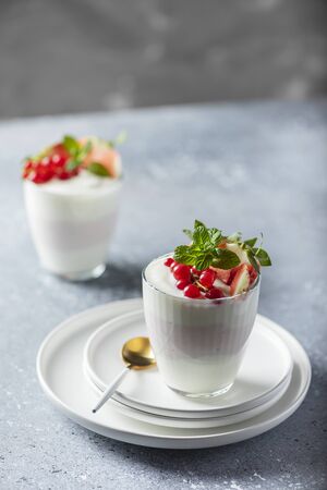 Homemade yogurt with strawberry, currant and mint, selective focus imageの写真素材