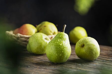 Sweet green pears on the wooben rustic table, selective focus imageの写真素材