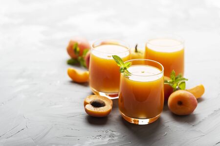 Fresh sweet apricot juice on the marble table, selective focus imageの写真素材