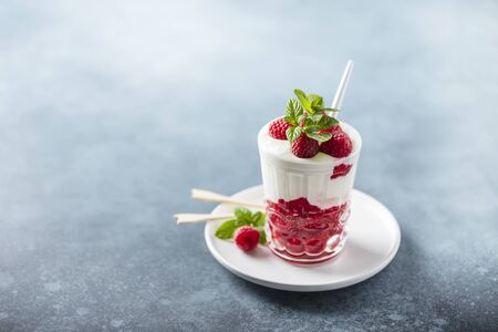 Healthy yogurt with raspberry and mint, selective focus imageの写真素材