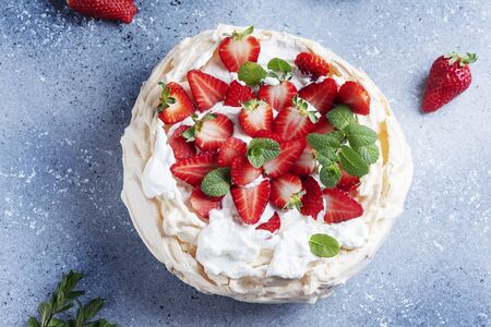 Cake Pavlova with meringue, strawberry and cream, selective focus imageの写真素材