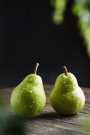 Sweet green pears on the wooben rustic table, selective focus imageの写真素材