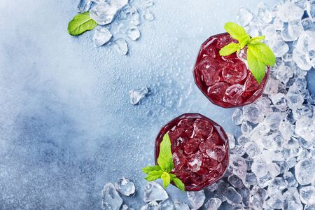 Top view image of a red coctail with ice and mint with a copy space, selective focusの写真素材