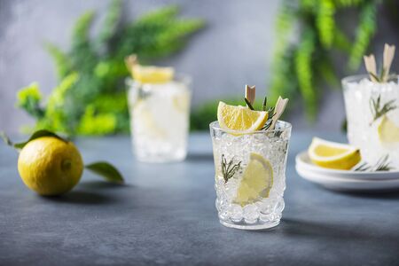 Summer fresh lemon soda cocktail with rosemary, selective focusの写真素材