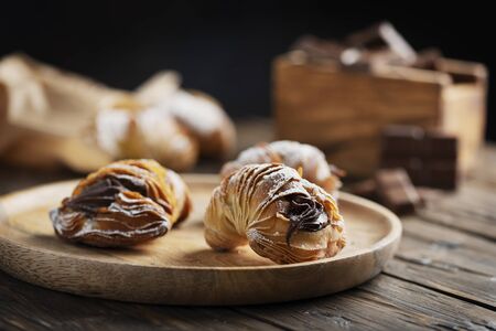 Traditional dessert of Naples aragosta with chocolate, rustic style and selective focus image