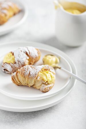 Italian traditional dessert aragosta with vanilla cream, selective focus image