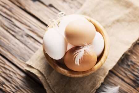 Fresh eggs on the wooden table, selective focusの写真素材