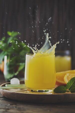 Orange cocktail on the wooden table, selective focusの写真素材