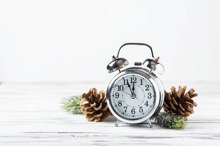 Christmas card with clock and christmas ornament, selective focus