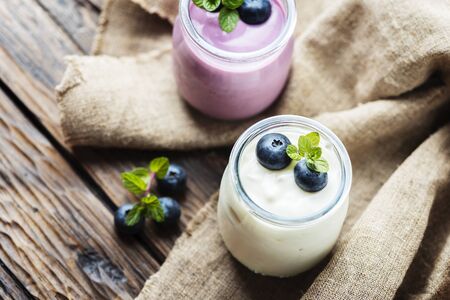 Homemade yogurt with blueberry and mint, selective focusの写真素材