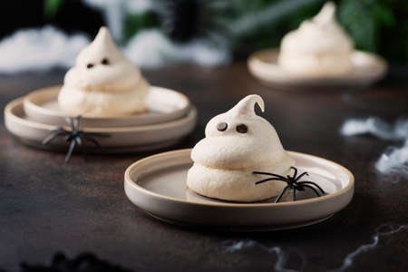 Concept of Halloween party with meringue and spiders, selective focus imageの写真素材